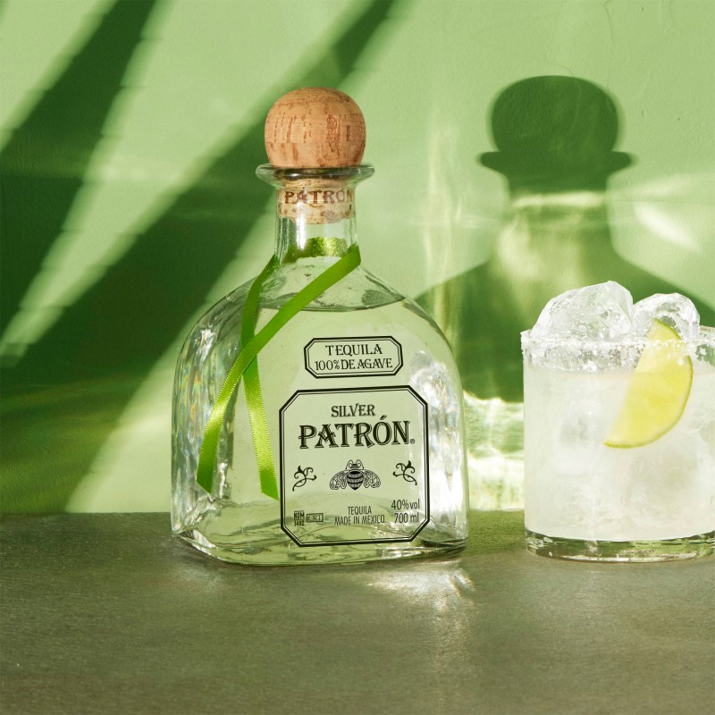 Patrón Silver bottle next to the Patrón Perfect Margarita.